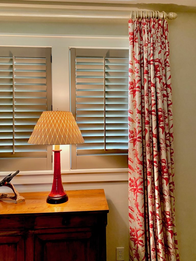 Window treatment ideas of plantation shutters with a drapery side panel