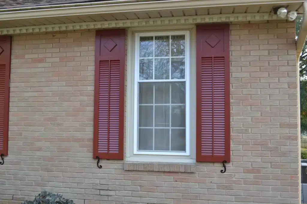 Fixed Louvered Shutters with decorative appliqué